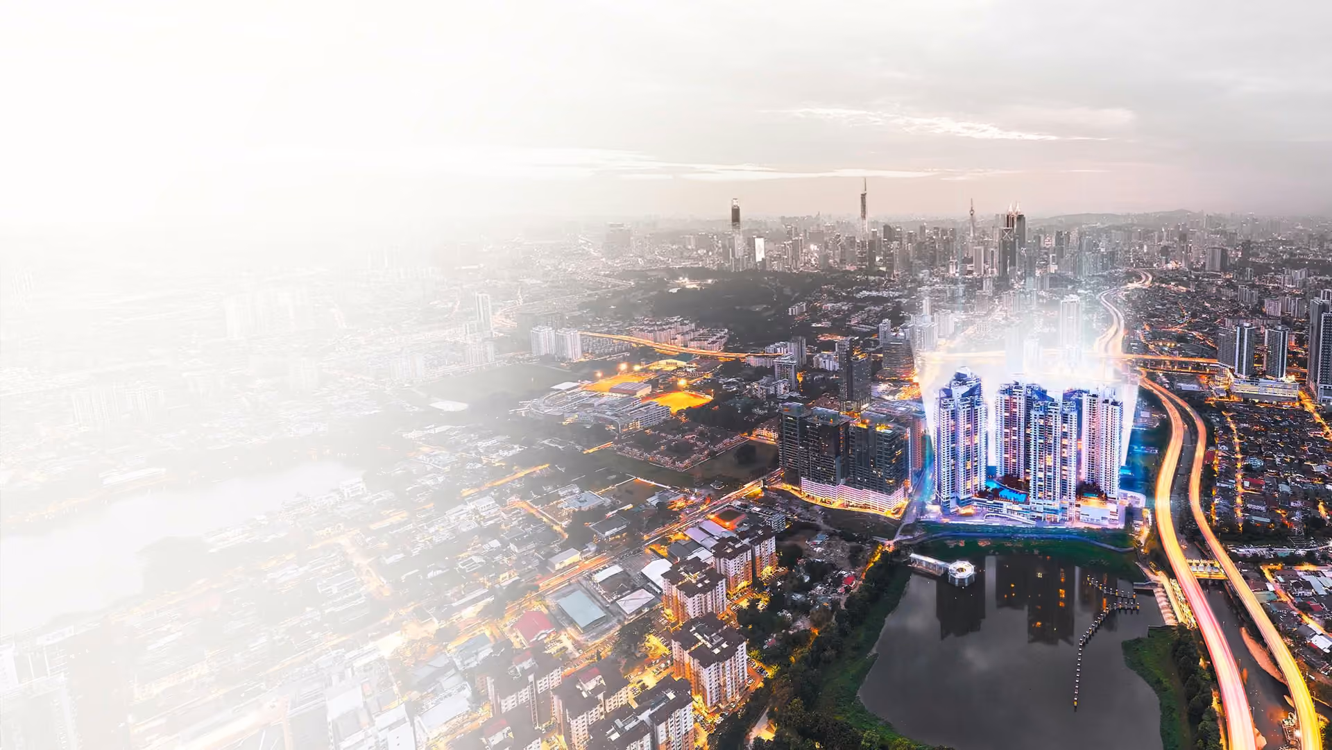 Aerial night view of Cappella Embassy in the Ampang Hilir embassy district, overlooking the Kuala Lumpur skyline and lake